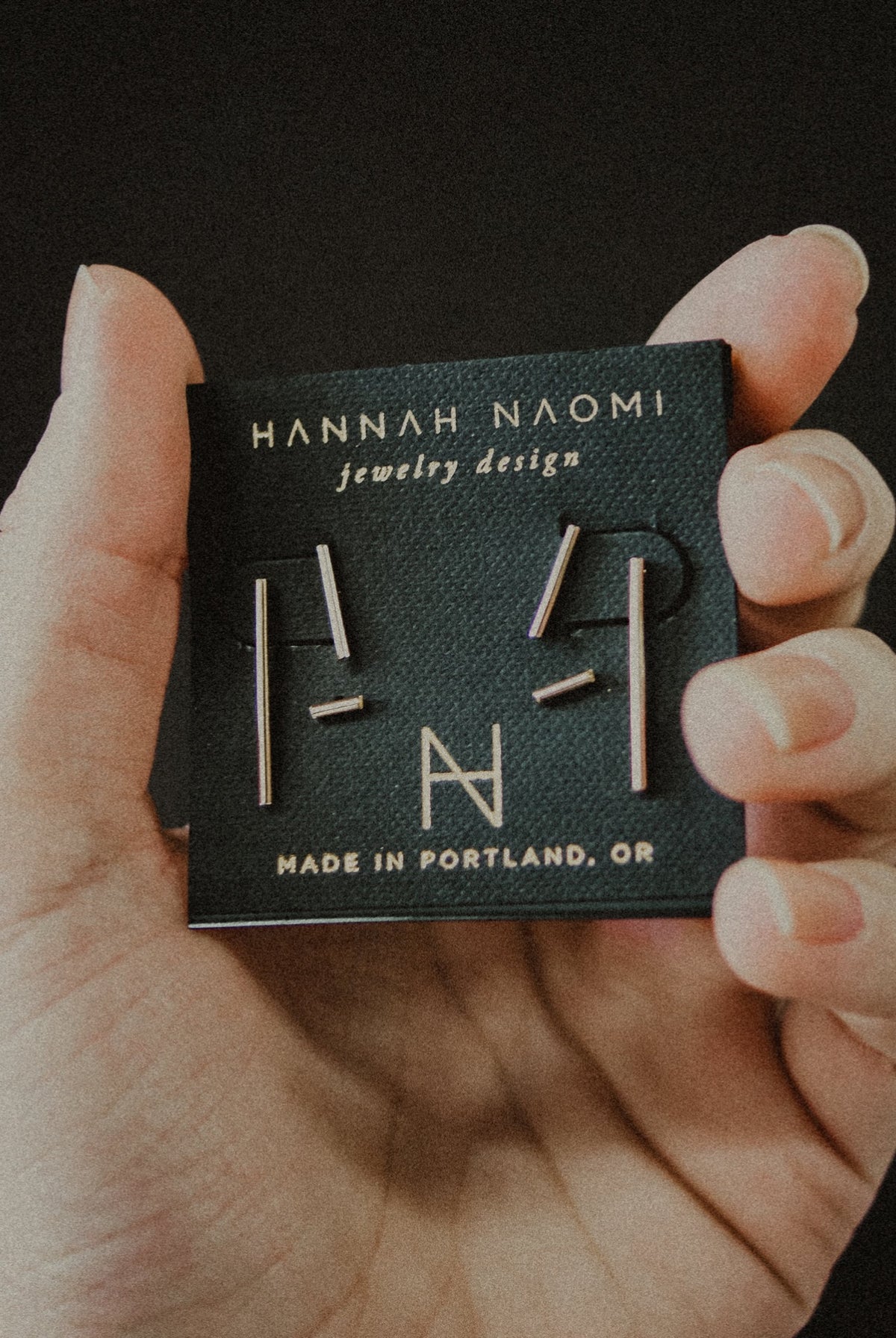BAR STUD EARRINGS IN AN EARRING CARD BY HANNAH NAOMI